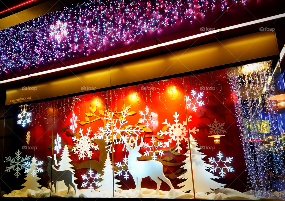 New Year's window decoration: deer and snowflakes