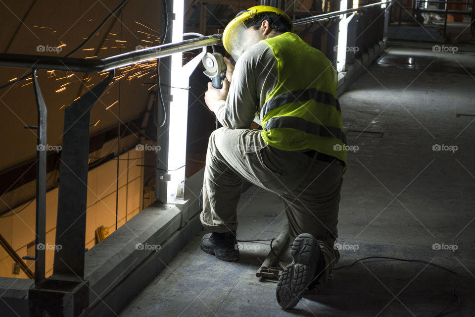 Man working with a weld tool