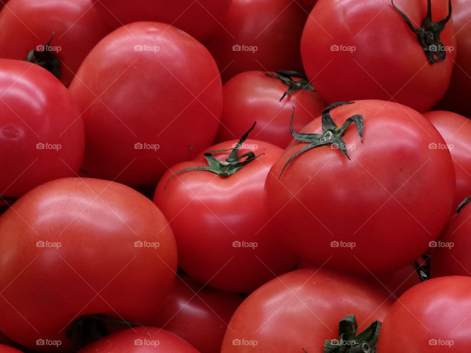 Fresh red tomatoes in the basket