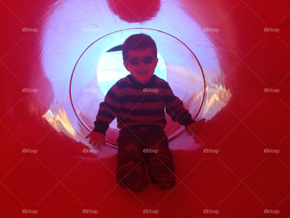 boy in red slide