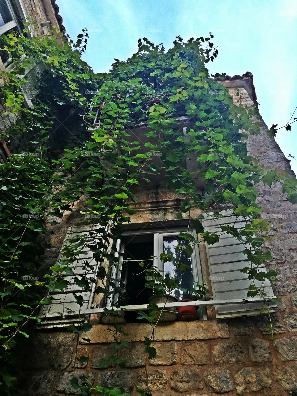 amazing architecture. old stone house with white windows