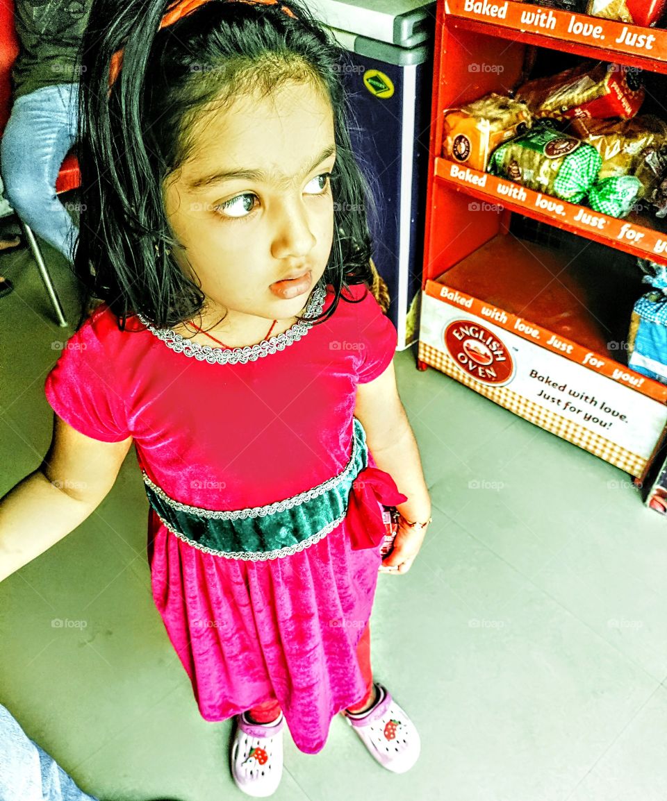 Girl child eye searching for her favourite item to eat