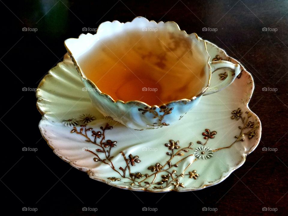 antique tea leaf gilded porcelain teacup and saucer