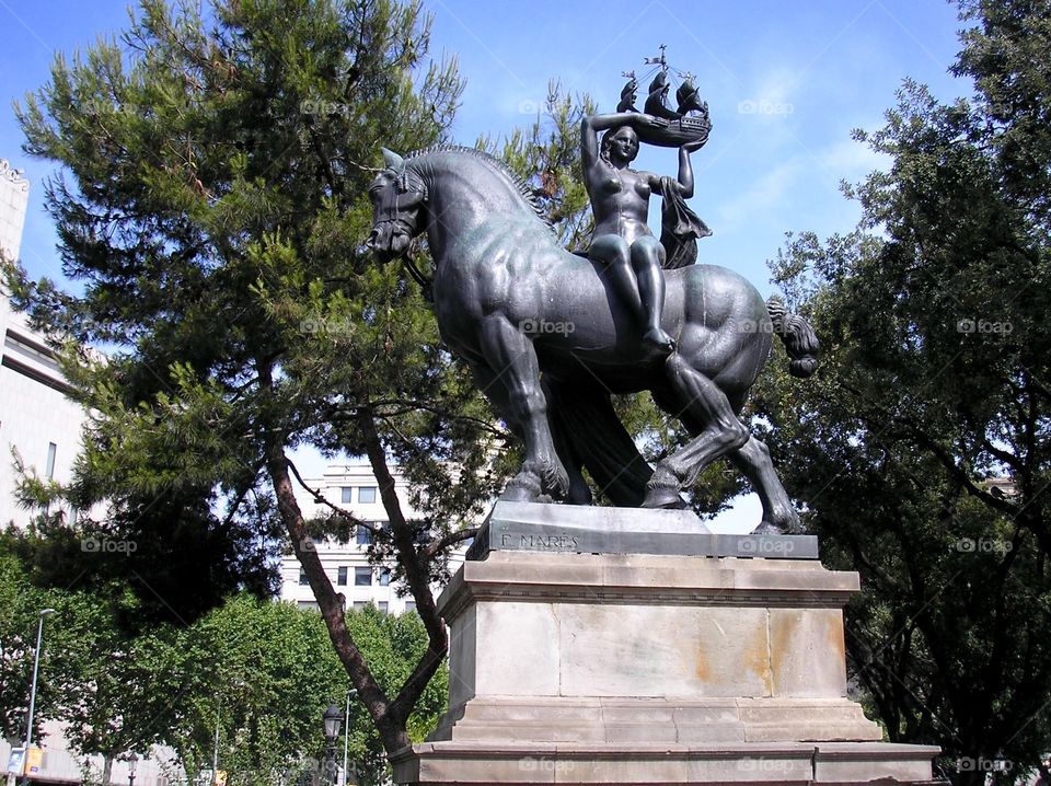A statue of a woman on a horse in Barcelona