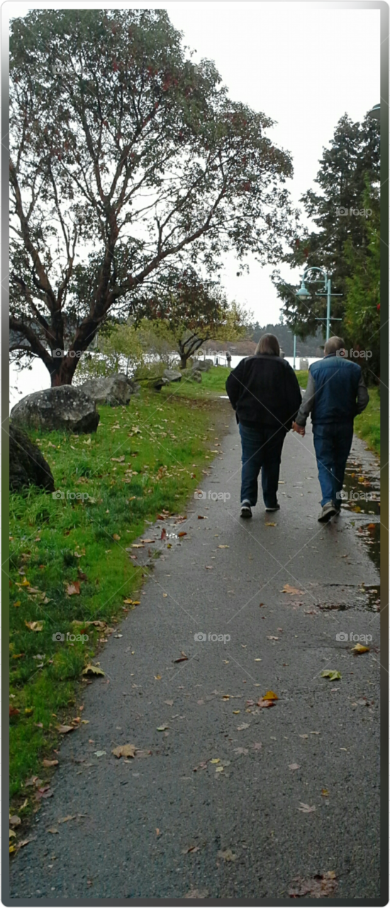 Couple holding hands on a walk