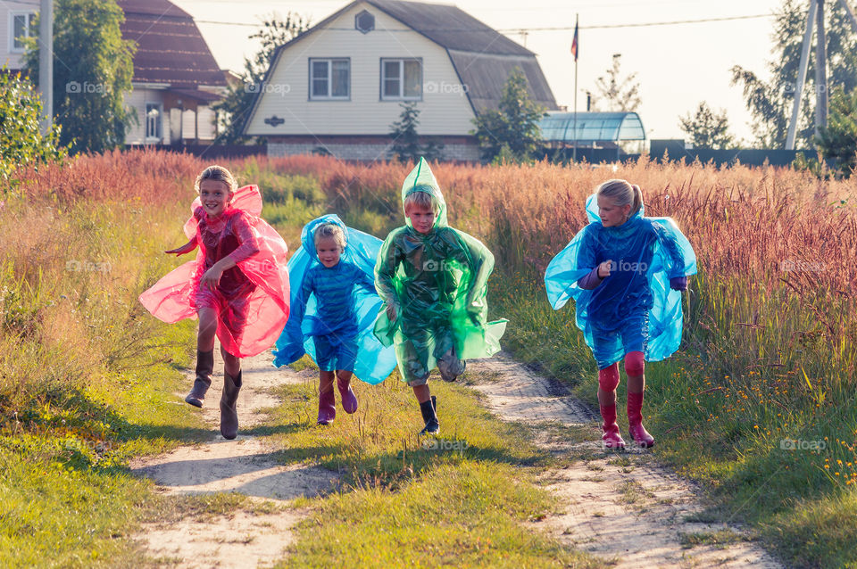 Kids are running along the road