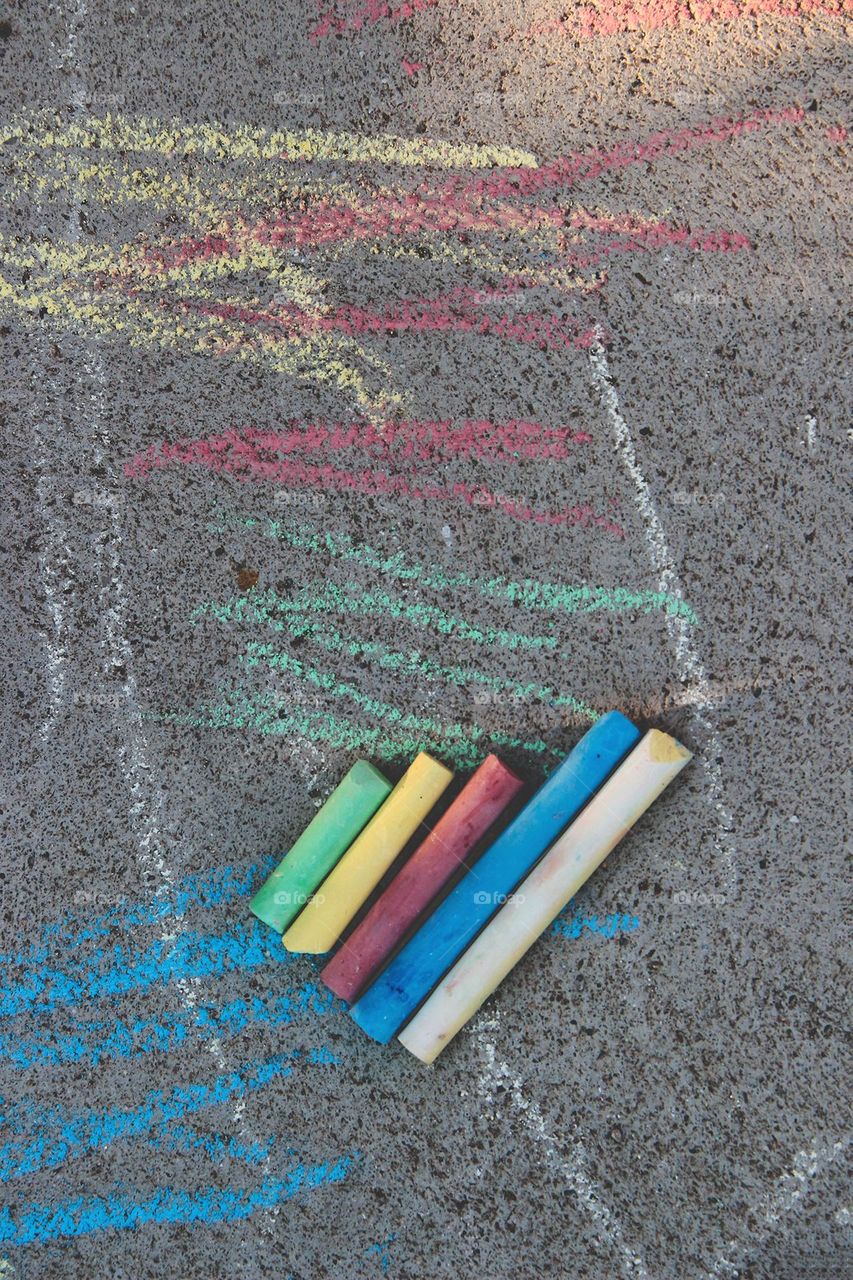 Colorful chalks on the pavement