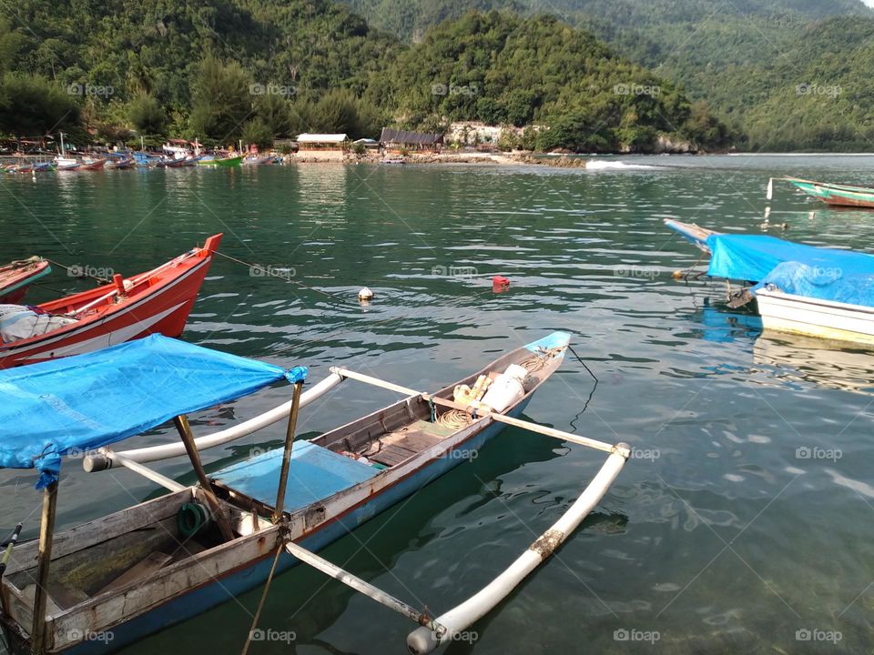 View of ships docked on the beach of Aceh, Indonesia.