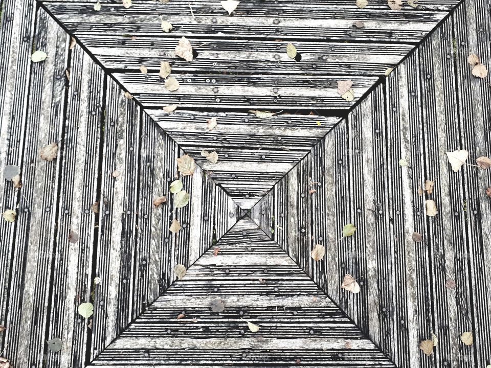 Middle of a wooden pontoon . Illusion of a corridor.