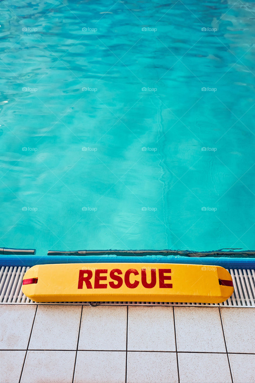 Lifesaver equipment on swimming pool. Candid people, real moments, authentic situations