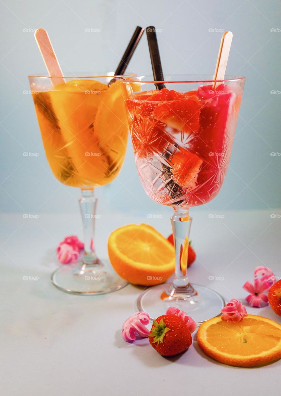 Colorful drinks with water fruit ice in the glass
