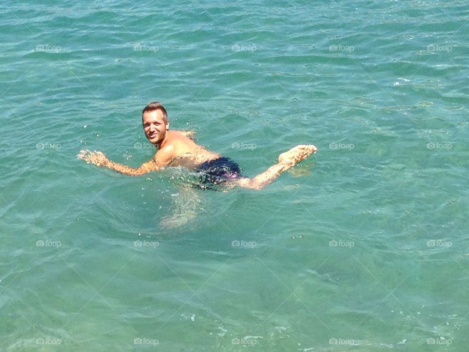 Run into water. A men look like a runner in the water,Turkey sea