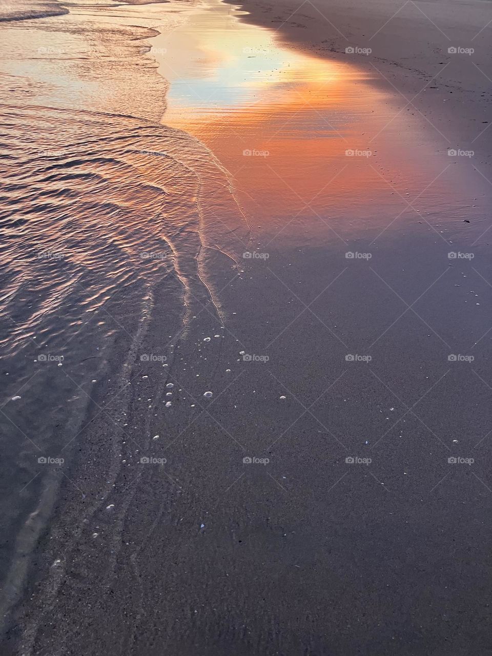 Sunset reflection on the beach