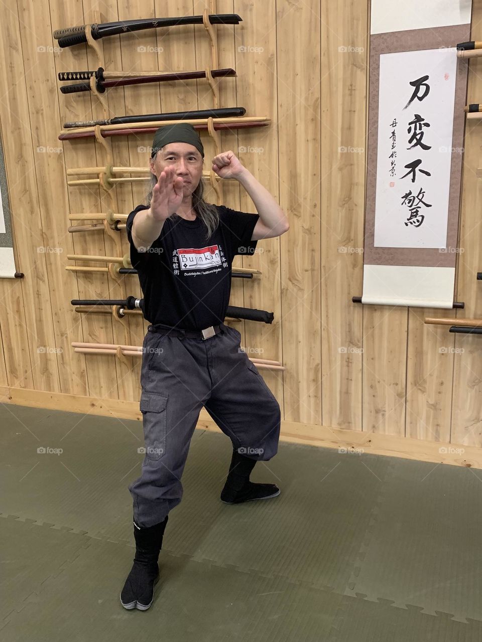 Ready to strike out from the combat posture at a martial arts dojo.