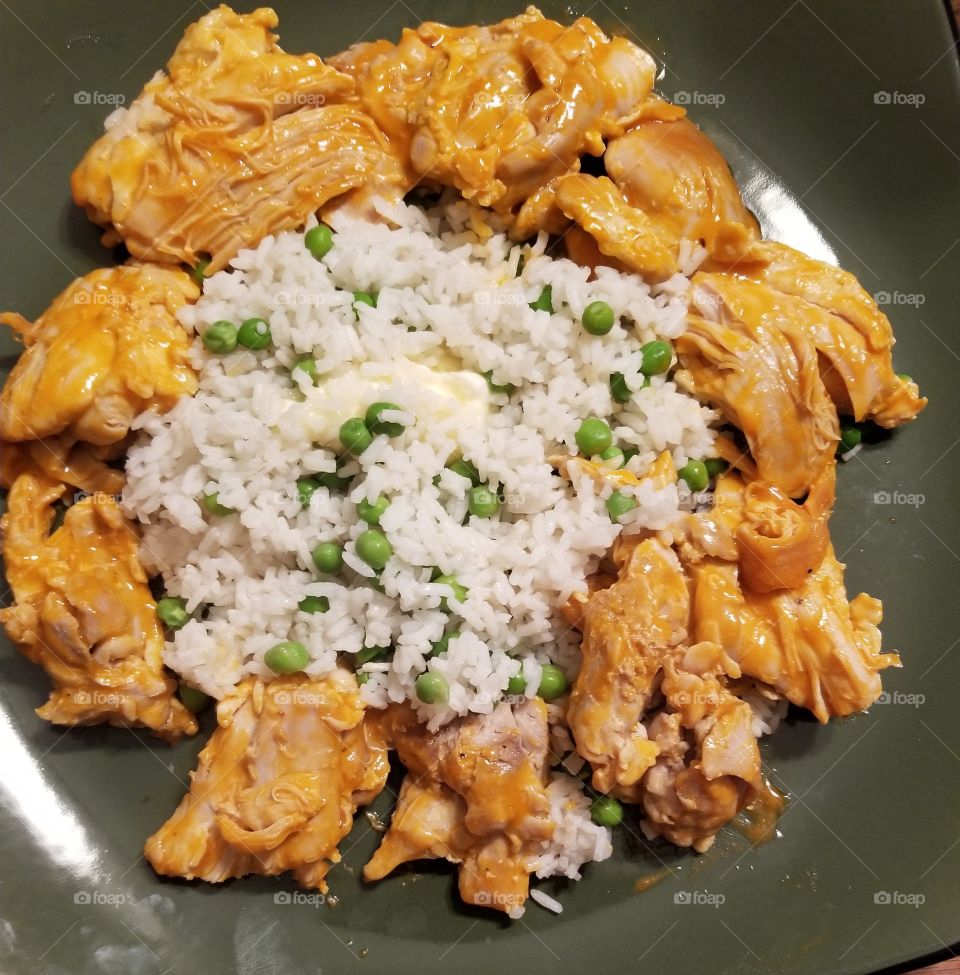 Buffalo  chicken thighs with peas and herbed rice