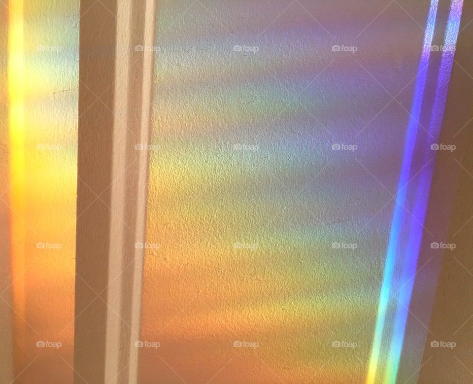 All the colors of the rainbow refracting spectral light through a prism.