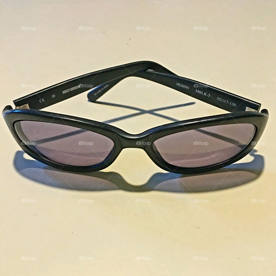 Black frame wrap sunglasses, transition prescription lenses that lighten & darken automatically.