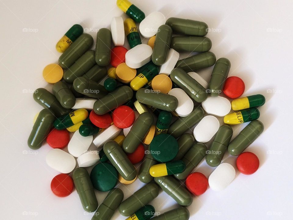 multicolored medicines on isolated white background