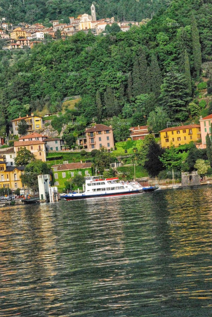 Ferry boat on Lake Como. A white ferry boat takes passengers to Bellagio on Lake Como