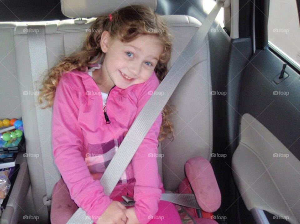 Child with seatbelt in the car