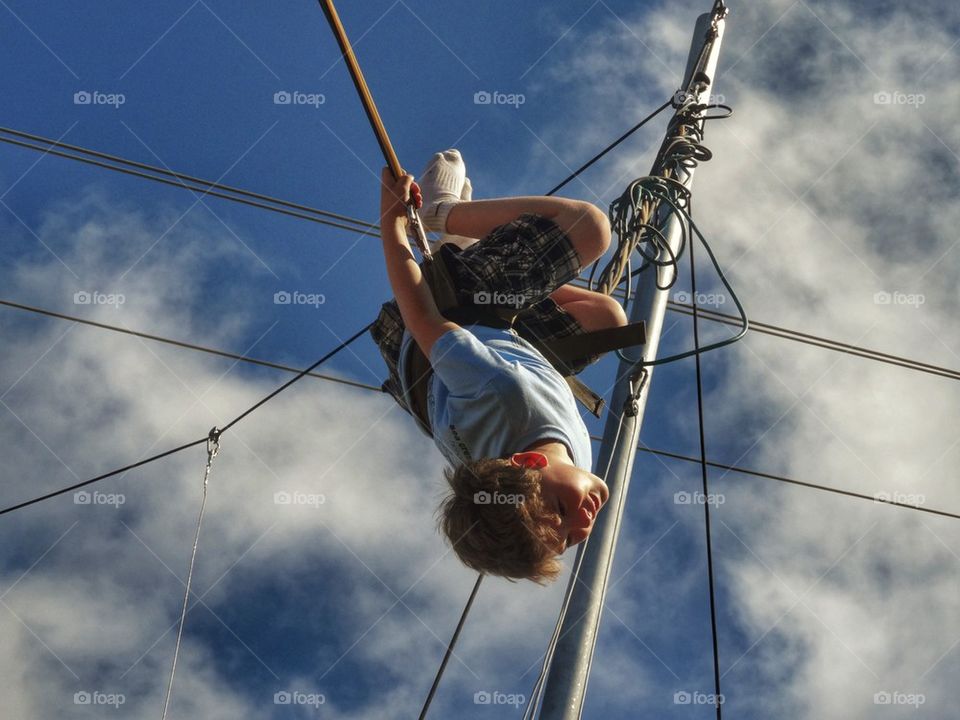 Boy Swinging Upside Down