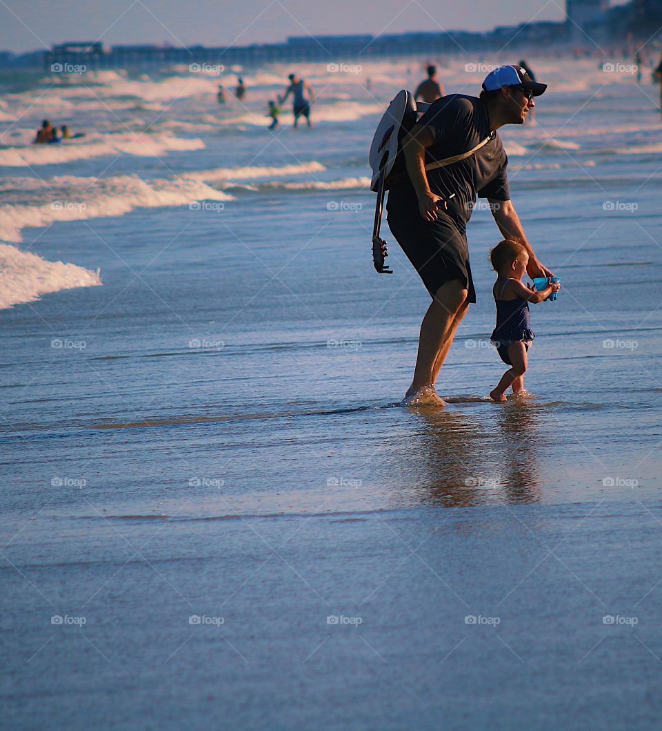 Parenthood father son beach vacation enjoying enjoyment leisure travel 