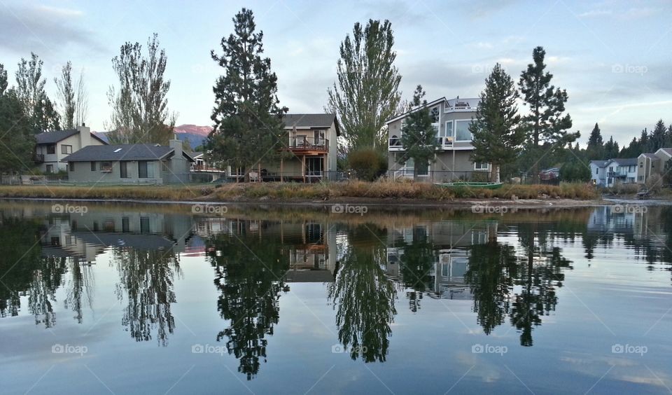 reflecting houses. canoeing in my friends backyard and saw this