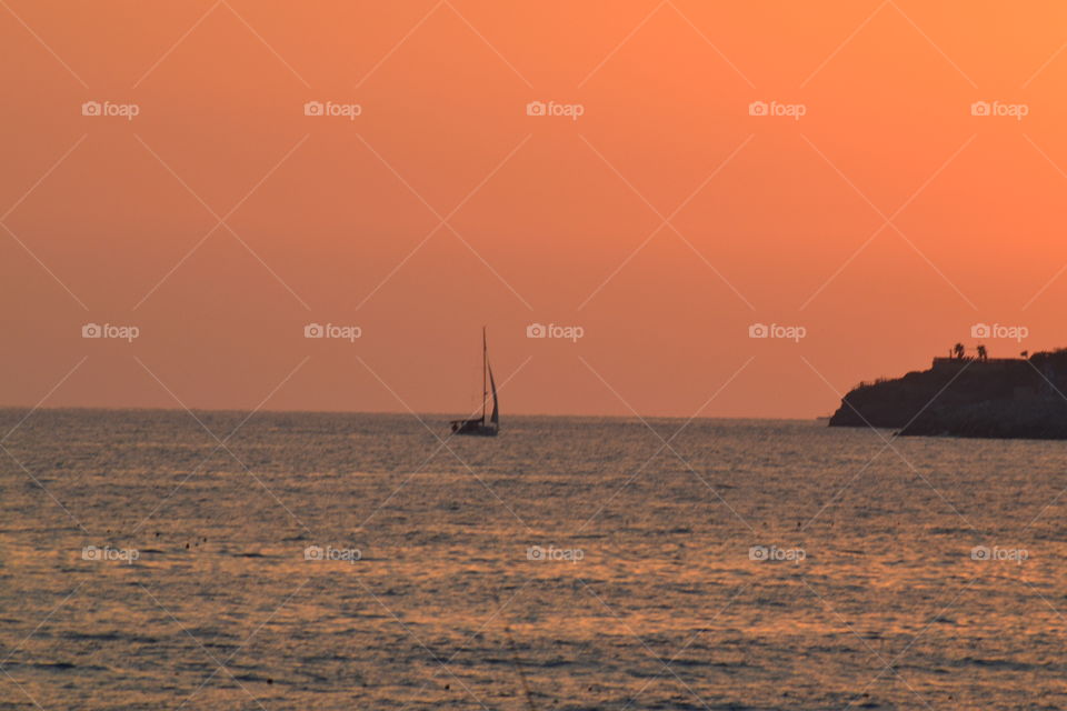 ship sailing off into the sunset