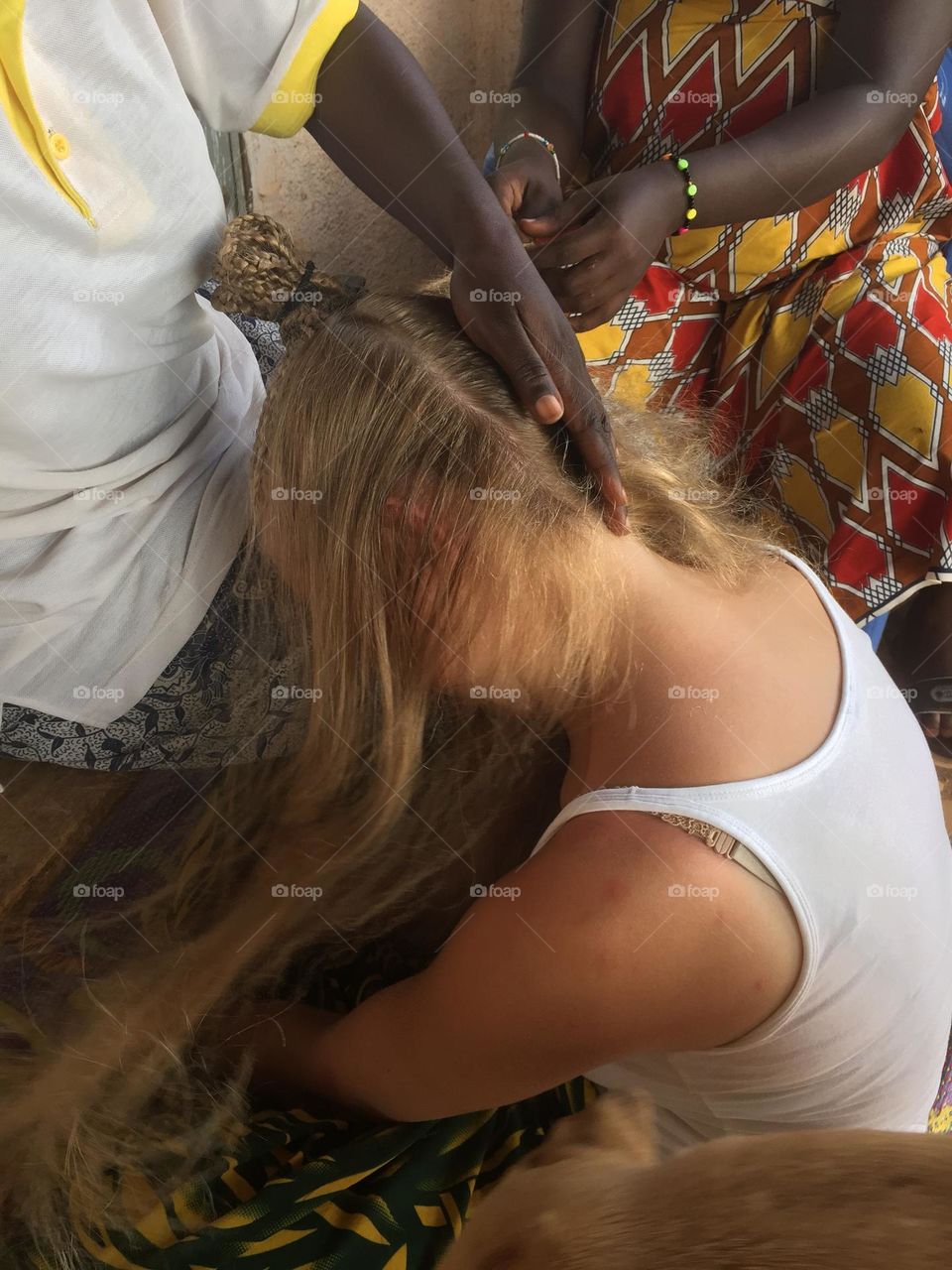 Blond girl going to a saloon to get hair braided