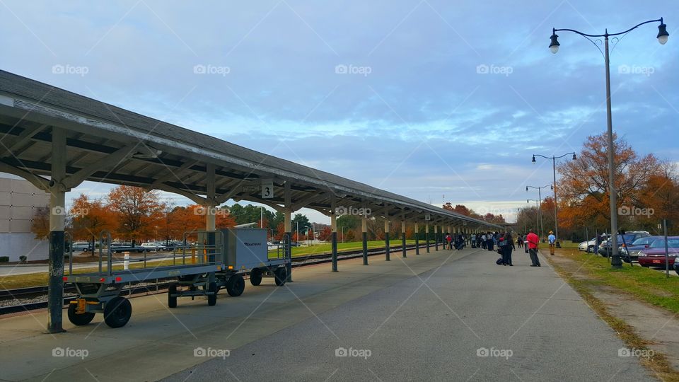 PEOPLE WAITING FOR TRAIN