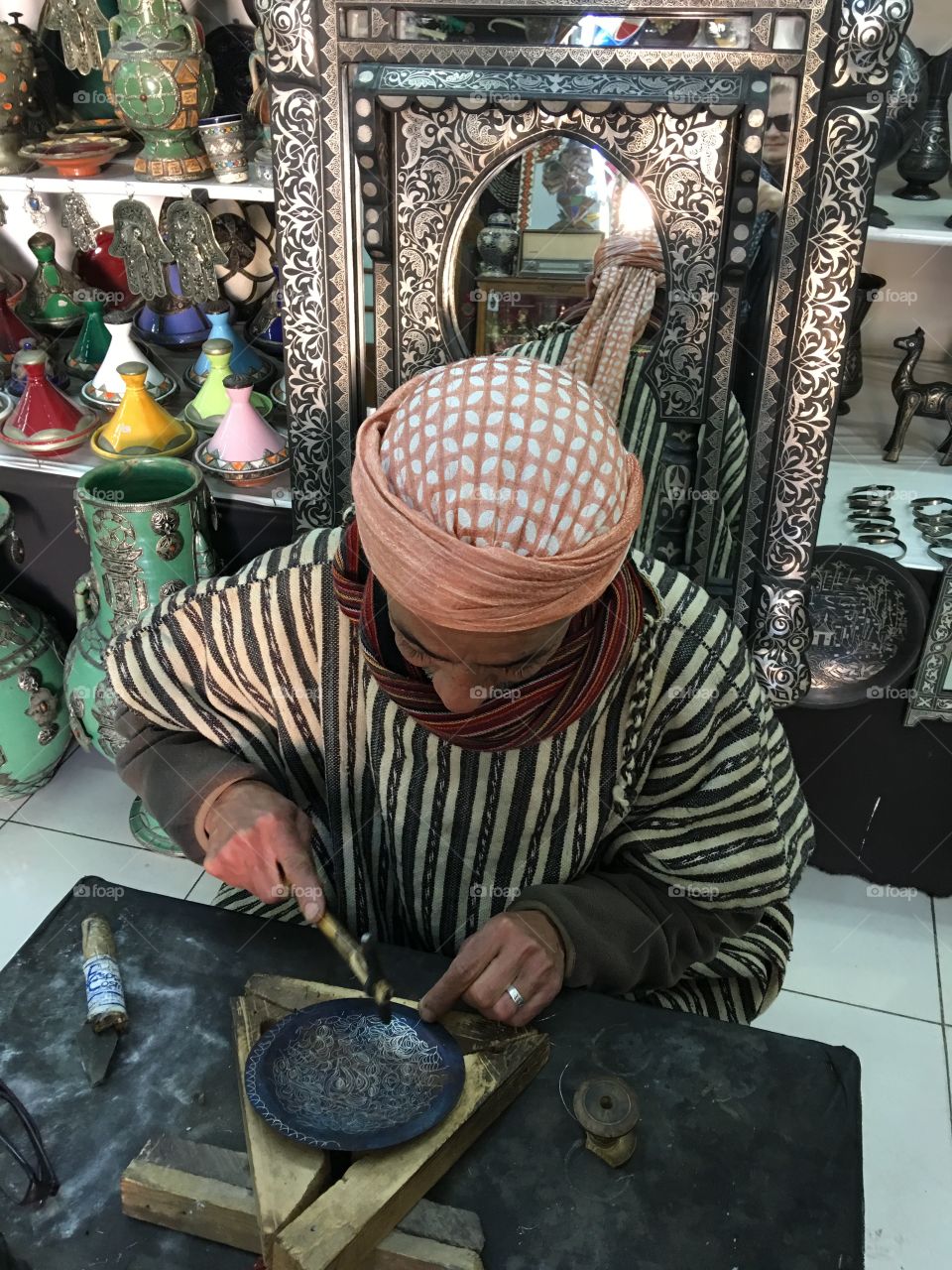 Artist working with metal 