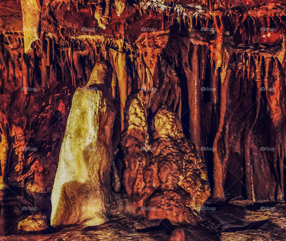 Rock formations that look a little like people praying in front of a cross, Grutas de Alvados - Central Portugal- 2019