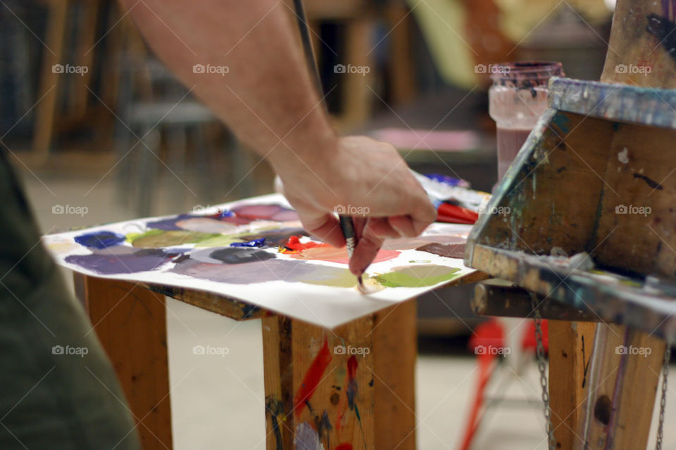 An artist paints in the studio