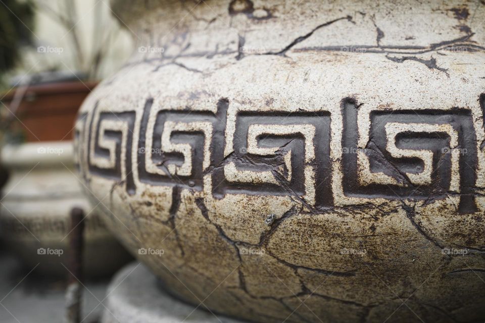 Ancient Greek pattern on an ancient vase , close up view .