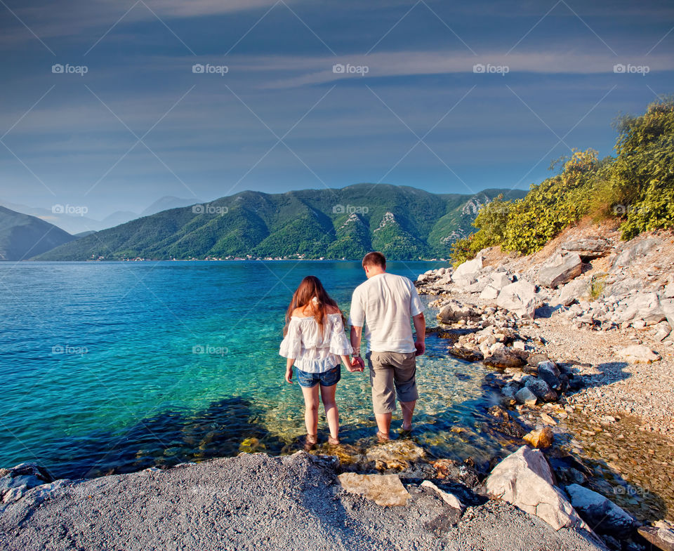 Couple on the bay at sunrise