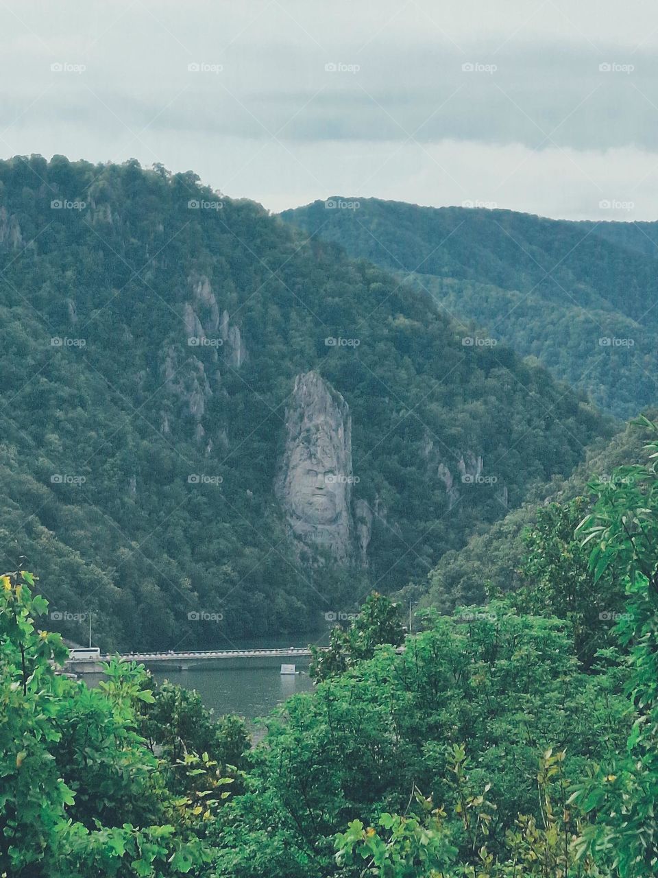 the sculpture of the face of the Decebal Dacian king, seen from the Serbian bank of the Danube.