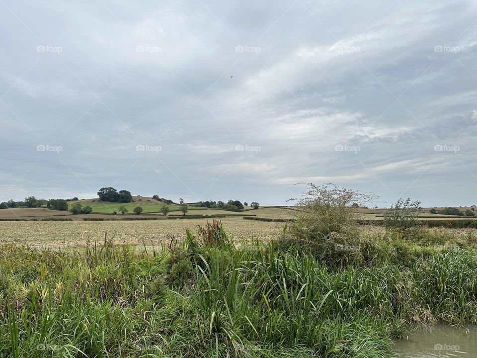 Late afternoon scene from narrowboat cruise Oxford canal country farm fields nature cool sky weather