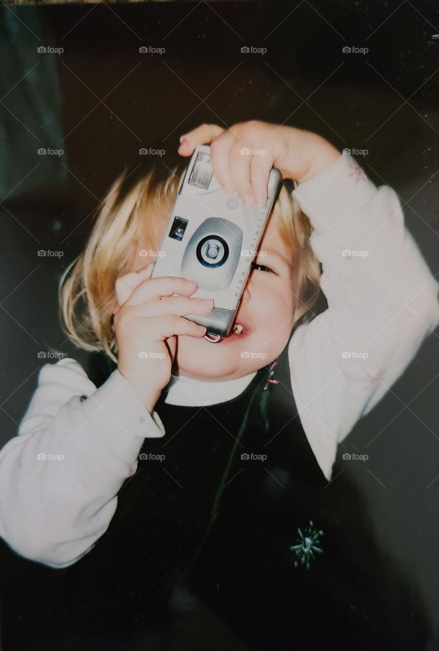 Young girl talking a picture of her father 