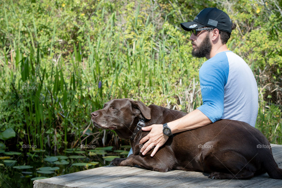 Pet time taking a break with chocolate lab