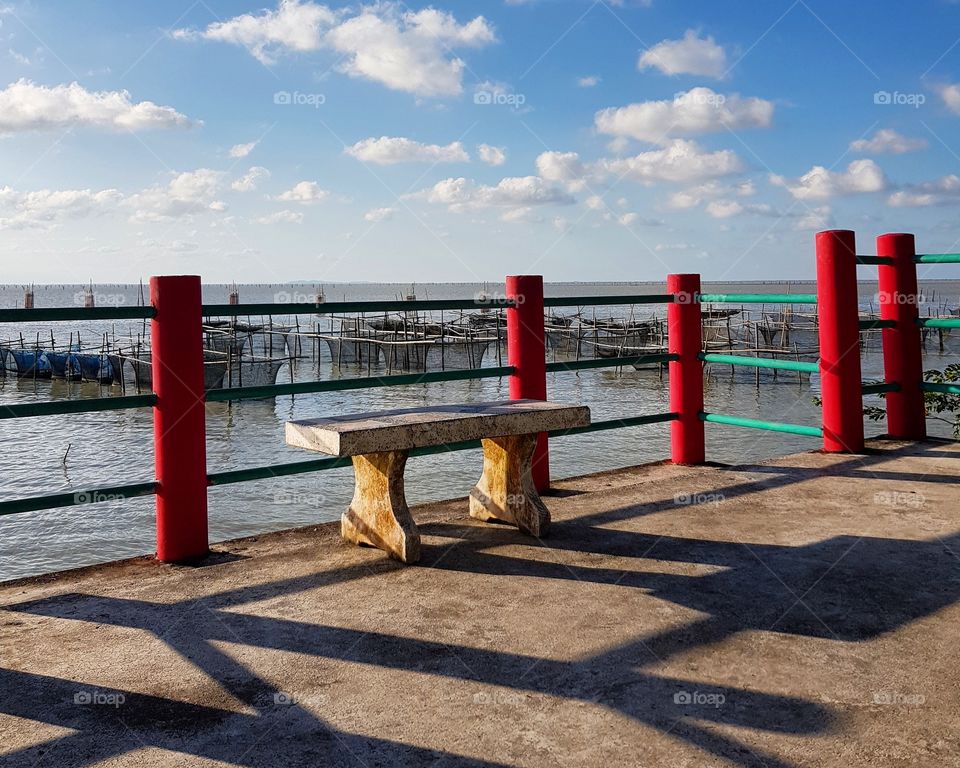 Scenic view of sea against blue sky