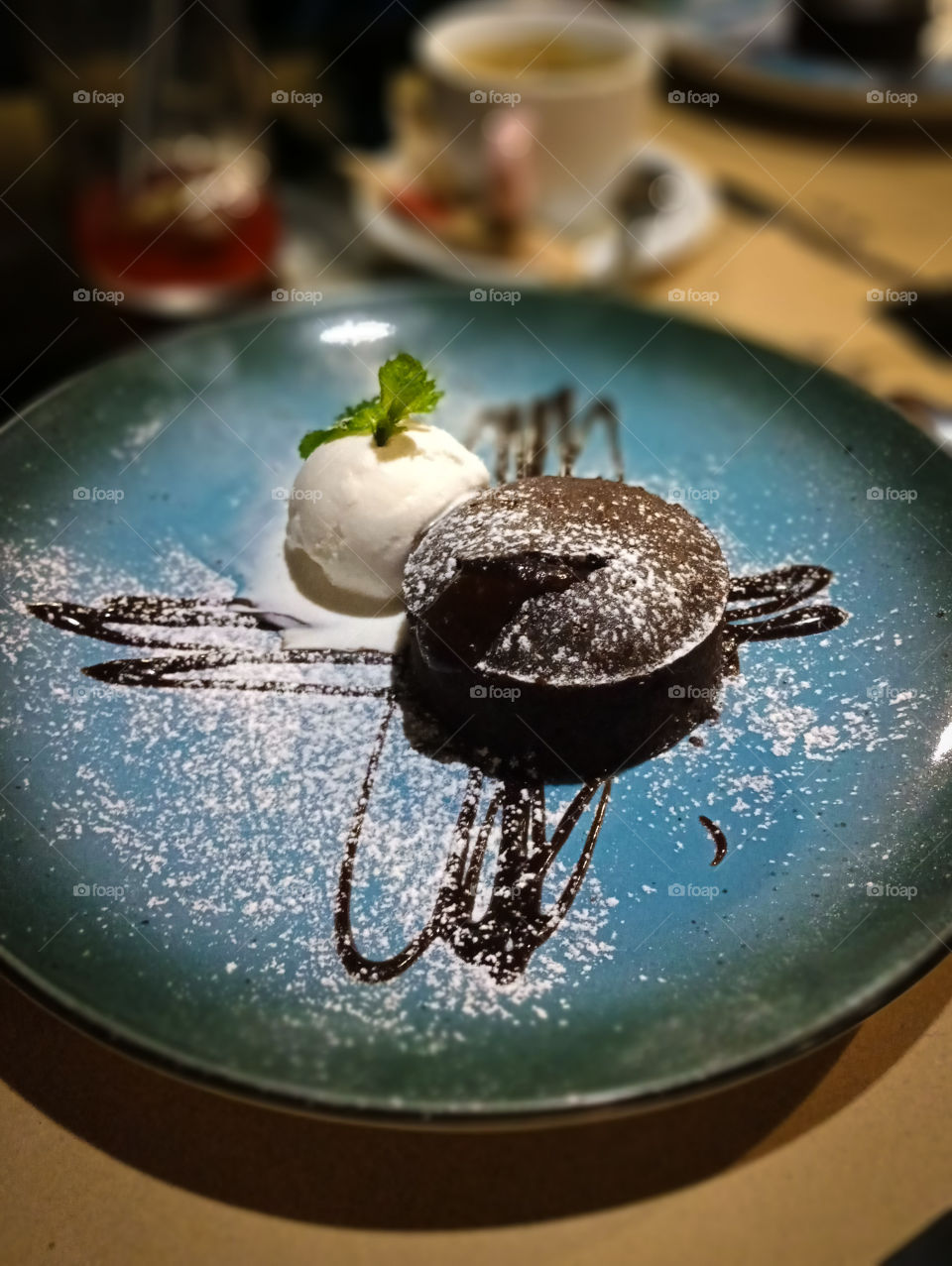 Chocolate fondant. Delicate chocolate cake with a refreshing ball of ice cream.