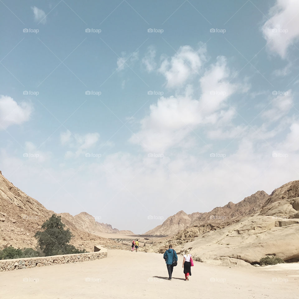 People walking by desert of Moses mountain in Sinai in Egypt in the morning 
