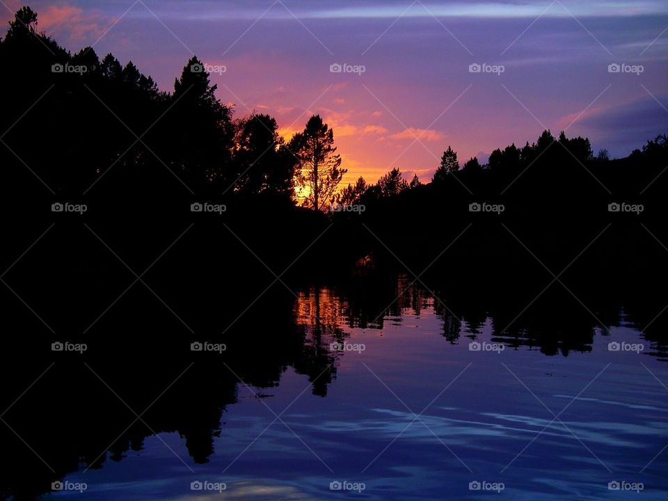 sunset at sea with island 