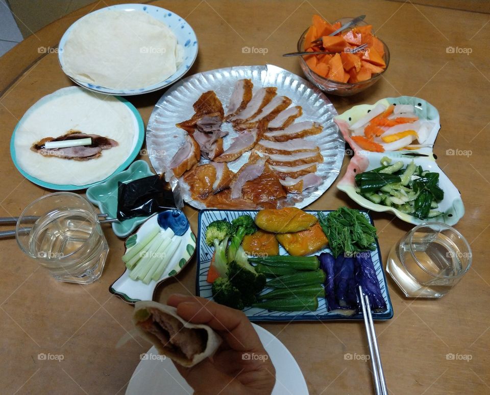 A roast duck dinner in Taiwan's family. it is very delicious, and we often take it back to eat from roast duck restaurant. several dishes vegetables also can buy from general cafeteria, eating in Taiwan is always very convenient, and very happy.
