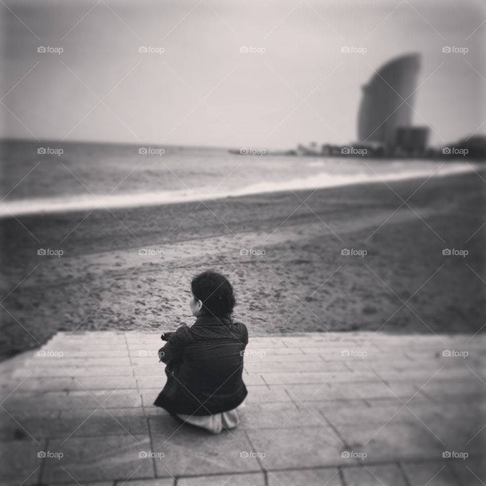 Emotions... Lonely girl in Barcelona beach..