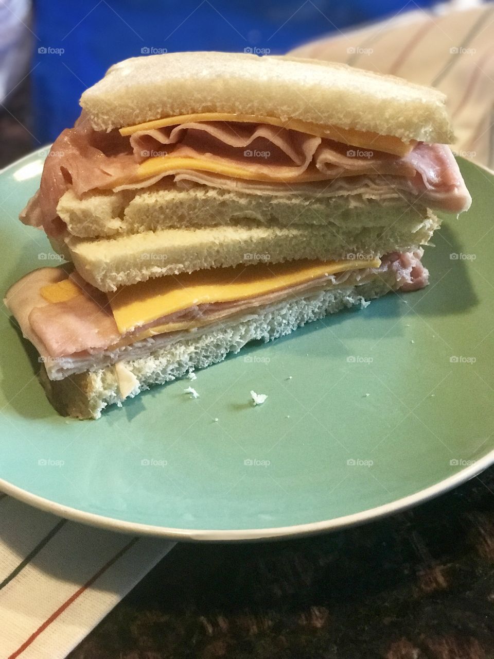   A Yummy and delicious cheddar cheese and ham sandwich served for lunch on a plate. USA, America 