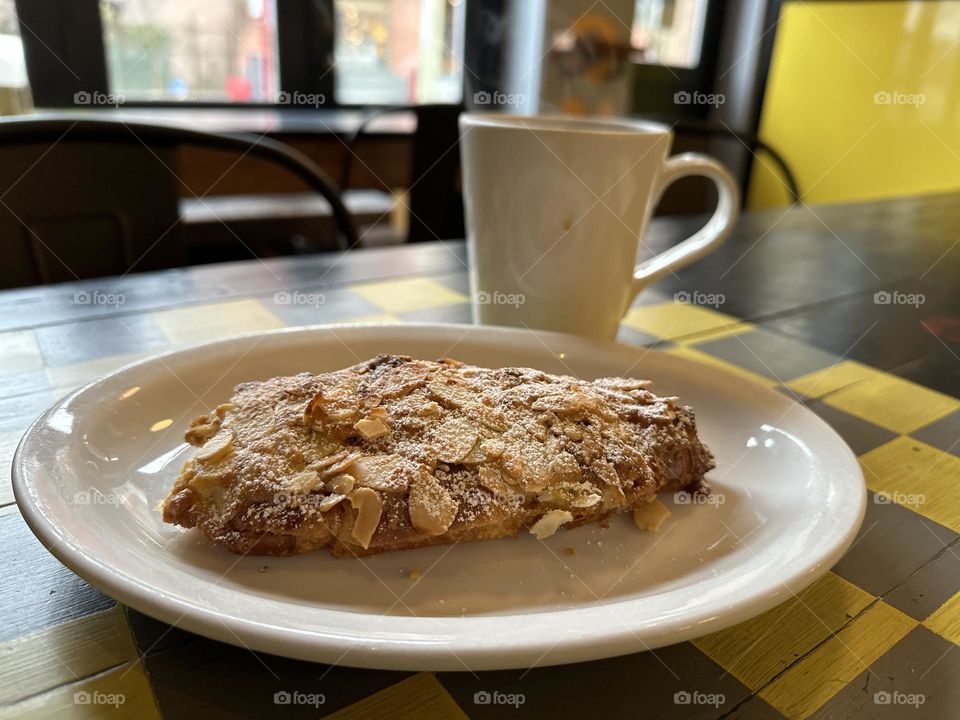 Croissant and coffee on a tabletop 