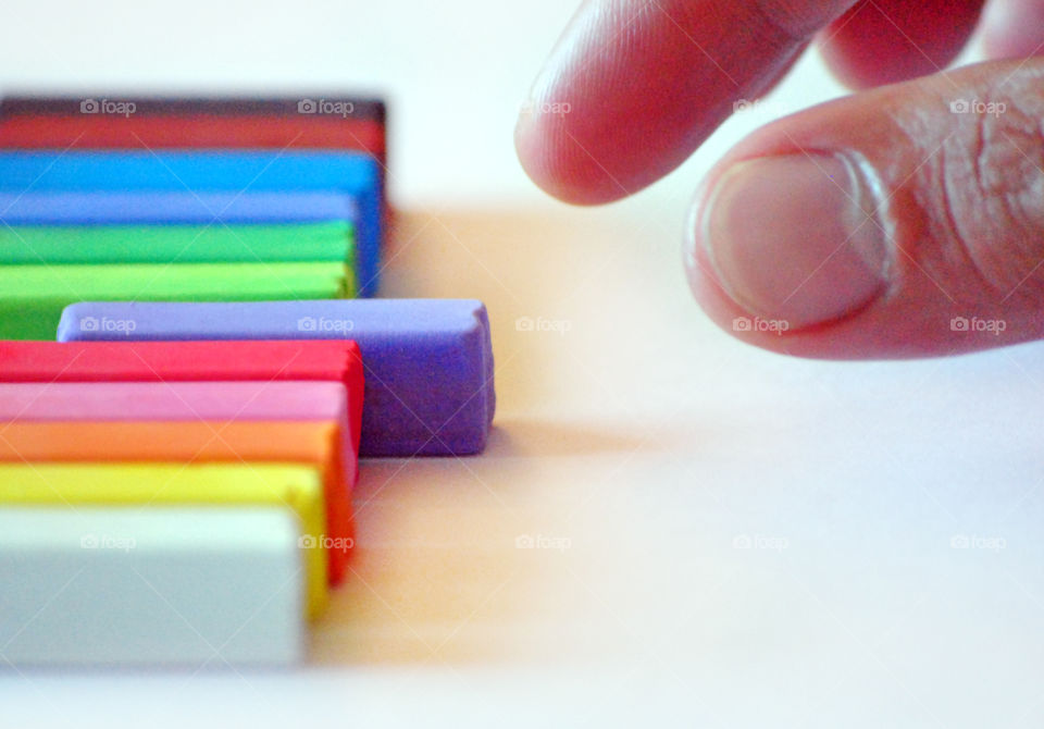 making decisions, picking which chalk color to use, hands reaching out