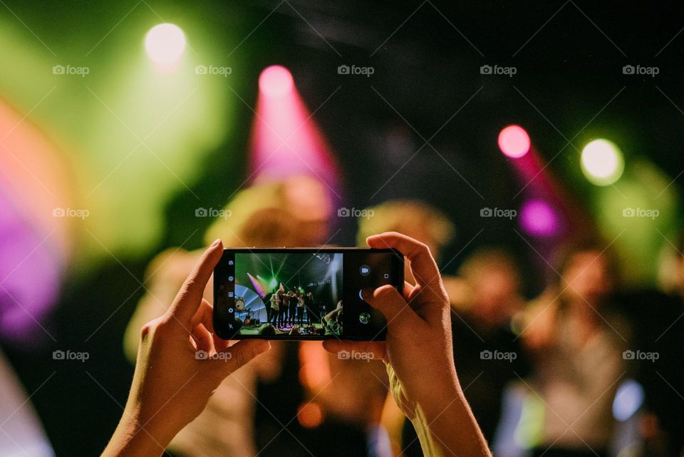 Taking picture at a concert. 