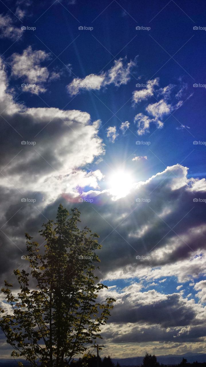Hand cloud holding the sun